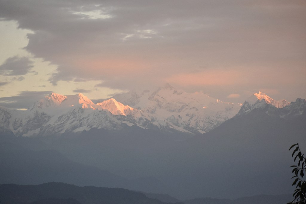 Sunrise golden light falling on Kanchenjunga mountains