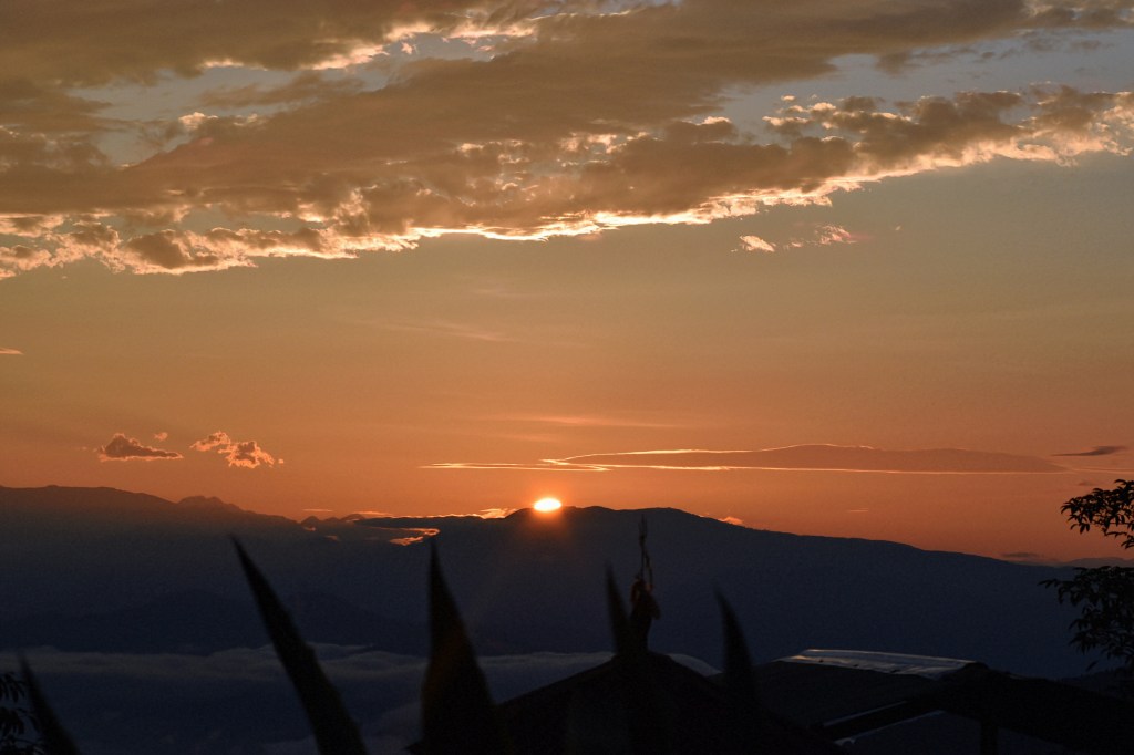 Sunrise view in Darjeeling with mountains and illuminous clouds