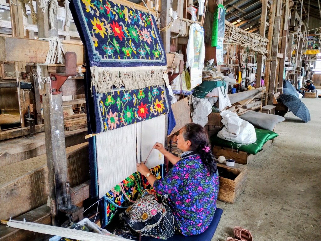 Artisans making carpets at Tibetan Refugee Centre Darjeeling